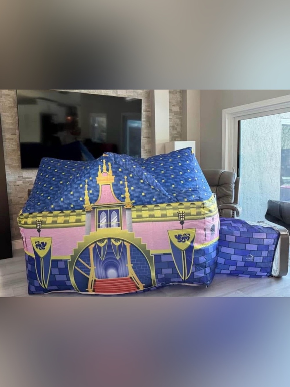 This is a Royal Castle themed AirFort play tent designed to inflate